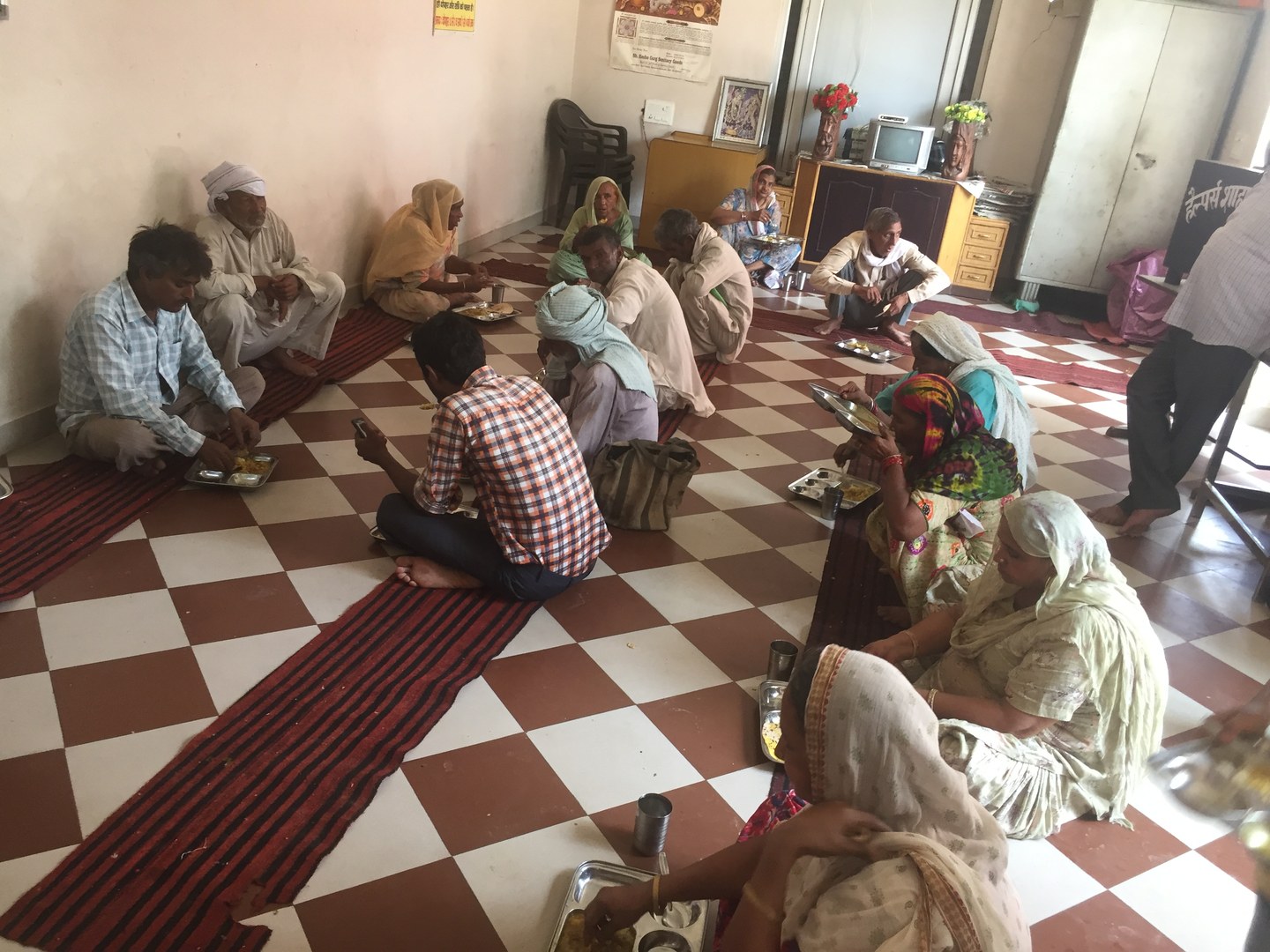 Devotees and needy citizens partaking in daily free Langar at Helpers Bhawan