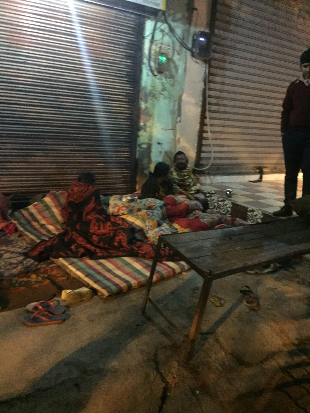 Volunteers assisting homeless individuals brought from highway corners